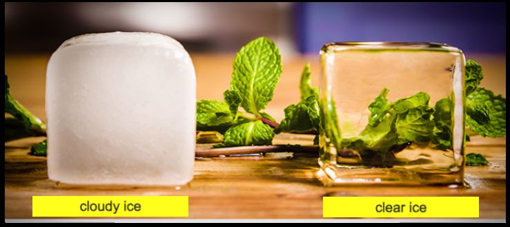 Cloudy ice cube on the left, crystal-clear ice cube on the right, both on a wooden surface